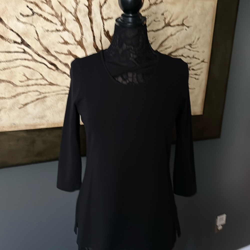 Soft 3/4 Sleeve Top with twist across chest.  Made in Peru.